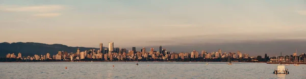 Vancouver city skyline panorama at sunset.