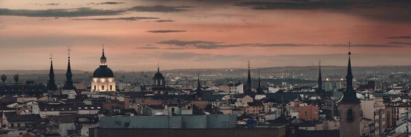 Madrid rooftop view of the city skyline at sunset in Spain.