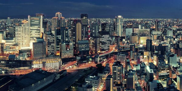 Osaka urban city at night panorama rooftop view. Japan.