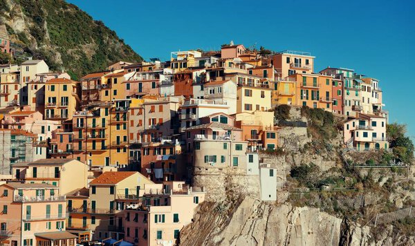 Italian style resident buildings over cliff in Manarola in Cinque Terre, Italy.