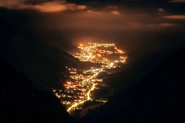 Dolomites village in valley at night in North Italy