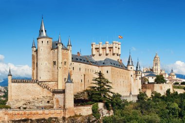 Alcazar of Segovia as the famous landmark in Spain. clipart