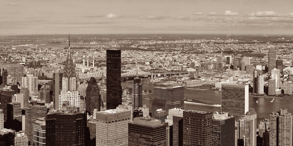 New York City Manhattan east side view panorama with skyscrapers and East River in black and white.