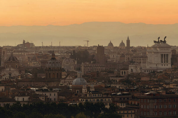 Rome rooftop view with ancient architecture in Italy before sunrise