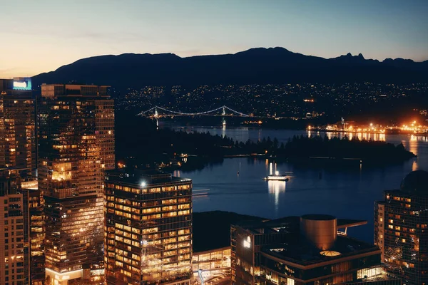 Vancouver rooftop view with urban architectures at dusk.