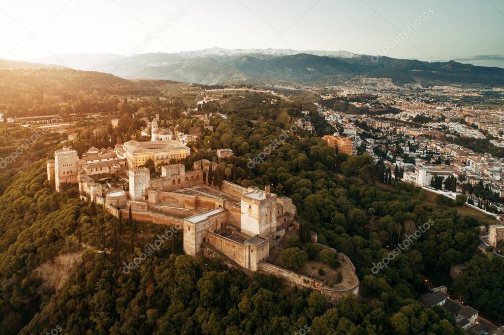Alhambra aerial view at sunrise with historical buildings in Granada, Spain.