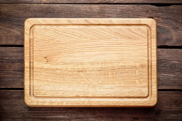 Fondo culinario con tabla de cortar vacía — Foto de Stock
