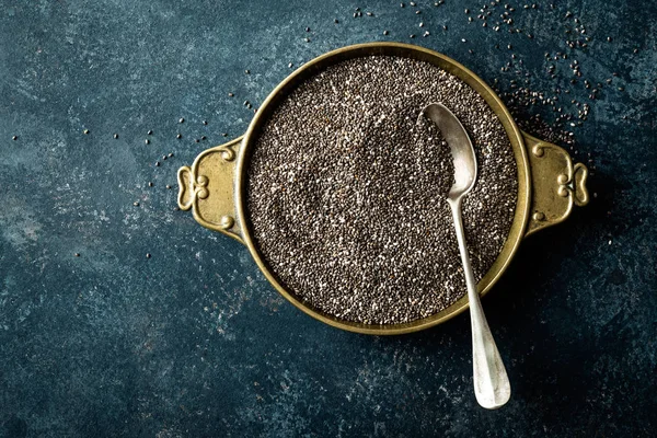 Chia seeds on dark baclground directly above copy space — Stock Photo, Image