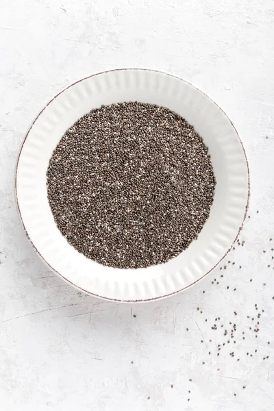 Chia seeds on white baclground directly above copy space — Stock Photo, Image
