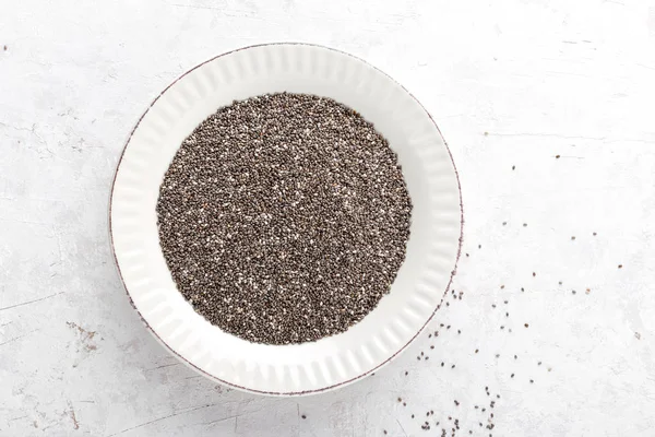 Chia seeds on white baclground directly above copy space — Stock Photo, Image