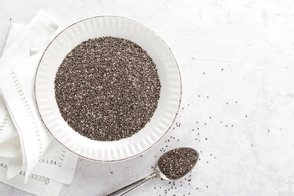 Chia seeds on white baclground directly above copy space — Stock Photo, Image