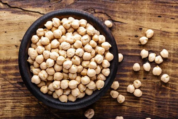 Chickpea on dark wooden rustic background — Stock Photo, Image