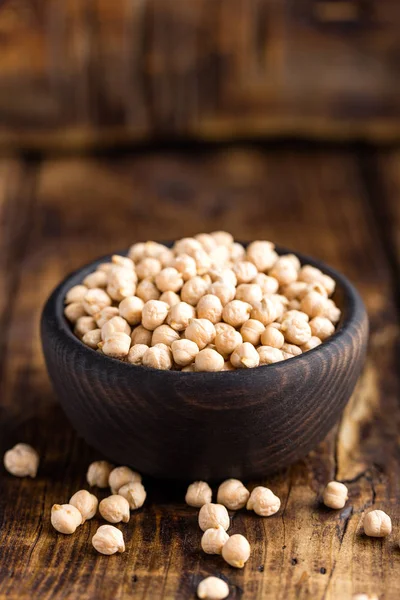 Chickpea on dark wooden rustic background — Stock Photo, Image