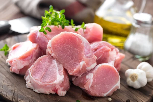 Raw meat, fillet, tenderloin on wooden background — Stock Photo, Image