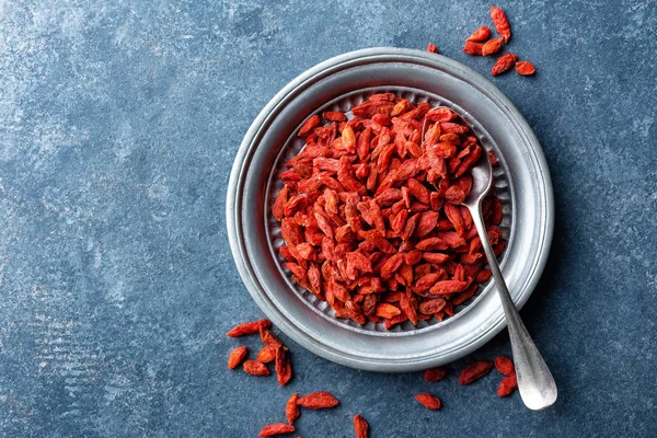 Goji berries on dark background, top view, copy space — Stock Photo, Image