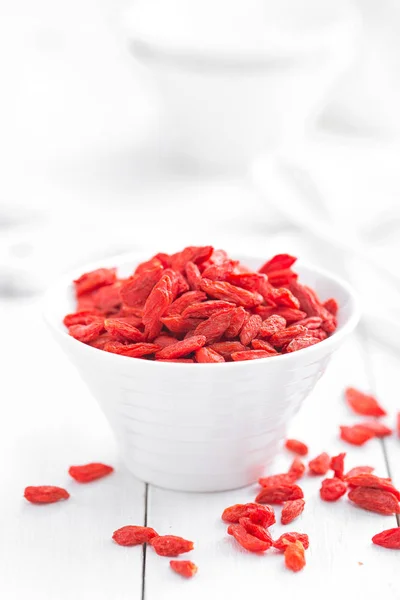 Goji berries in bowl on white background — Stock Photo, Image