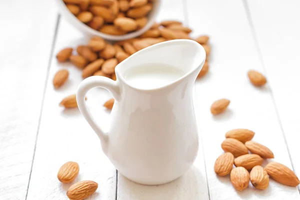 Almond milk and nuts — Stock Photo, Image