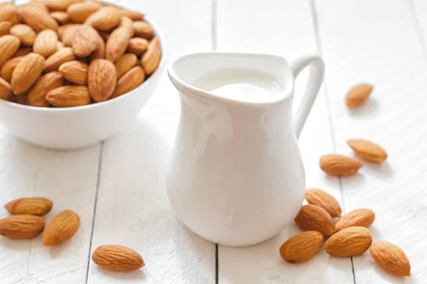 Almond milk and nuts — Stock Photo, Image