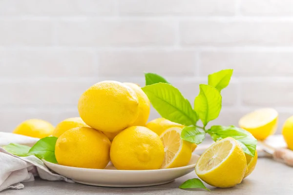 stock image Fresh lemons with lemon leaves