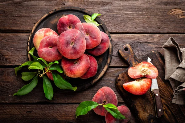 Peach, saturn or donut peaches with leaves — Stock Photo, Image
