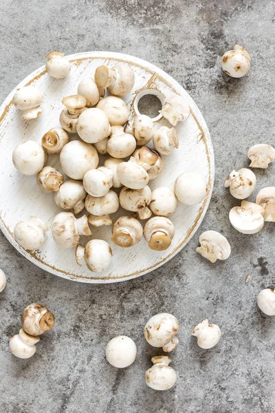 Raw mushrooms on board top view — Stock Photo, Image