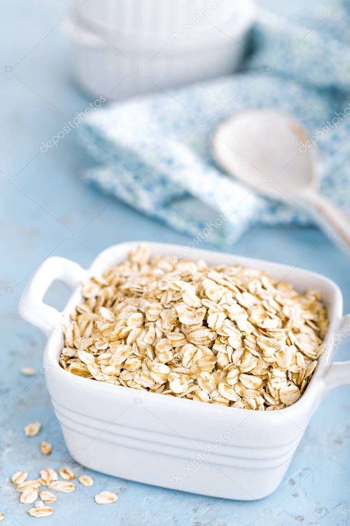 Oat flakes in bowl on table