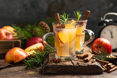 Christmas mulled apple cider with cinnamon and anise, traditional winter warming hot drink, beverage or cocktail clipart