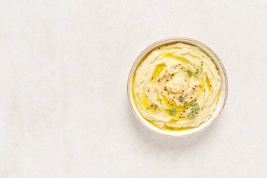 Hummus, mashed chickpeas with lemon, spices and herbs clipart