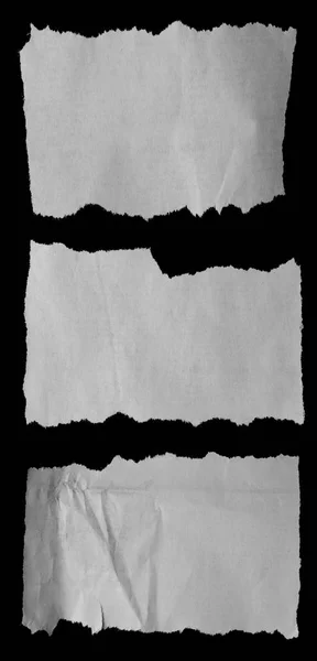 Zerrissene Papiere auf schwarz — Stockfoto