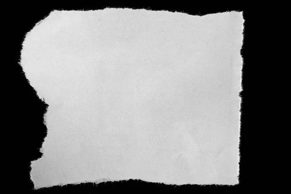 Torn paper on black — Stock Photo, Image