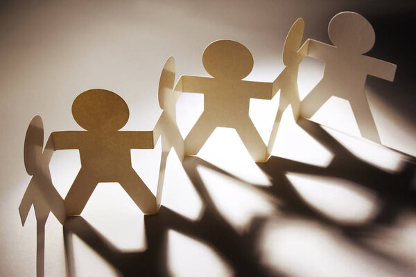 Paper chain team holding hands