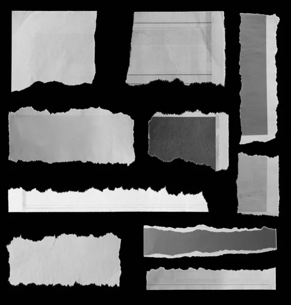 Zerrissene Papiere auf schwarz — Stockfoto