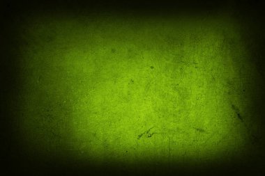 Closeup of green textured wall, dark edge