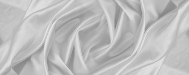 Dalgalanan beyaz ipek kumaş çizgilerinin yakınlaştırılması