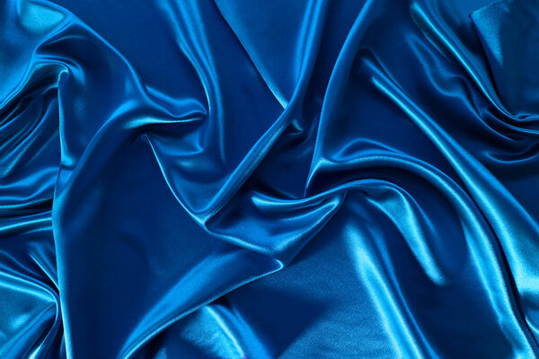 Closeup of lines in blue silk fabric 