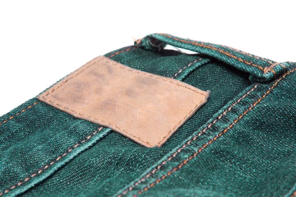 Leather label on green jeans. — Stock Photo, Image