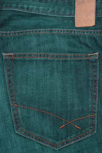 Leather label on green jeans. — Stock Photo, Image