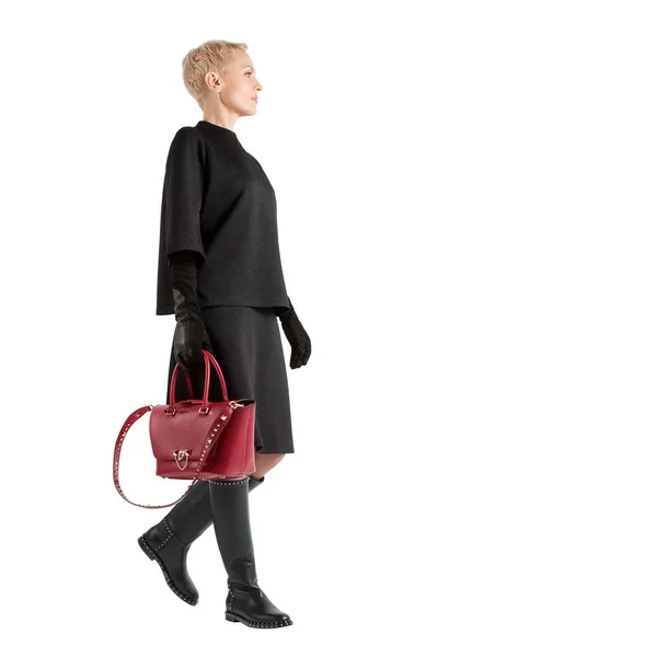 Meisje met rode tas en hoge laarzen — Stockfoto