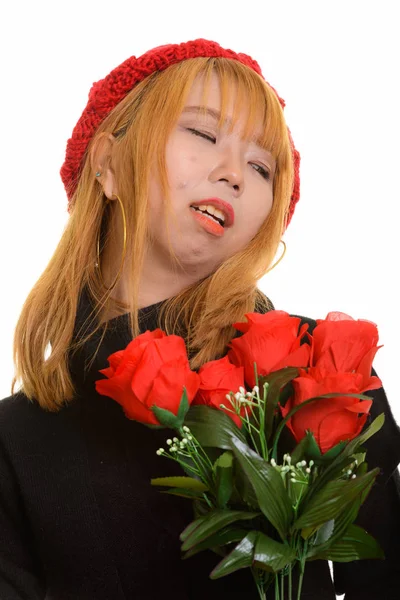 Fiatal Szomorú Ázsiai Vörös Rózsákkal Kezében Félrenéz — Stock Fotó