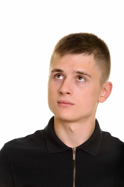 Thoughtful young Caucasian man looking up — Stock Photo, Image