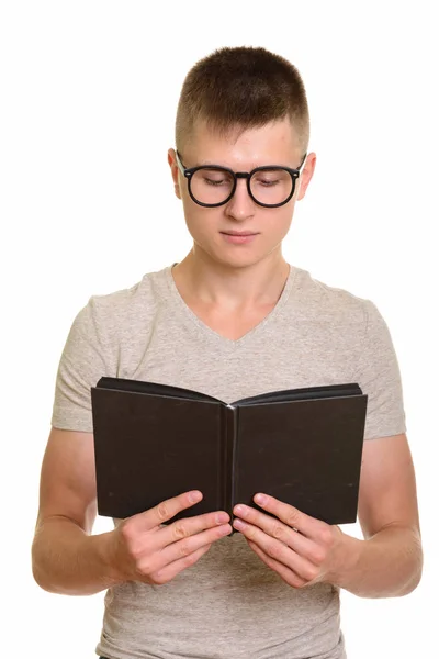 Young Caucasian man reading book — Stock Photo, Image