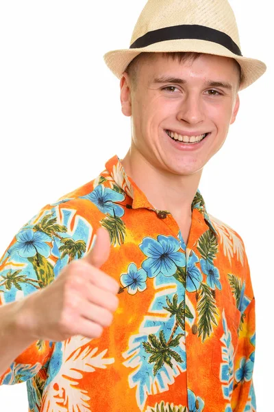 Young happy Caucasian man smiling and giving thumb up — Stock Photo, Image