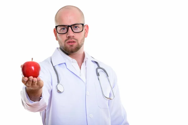 Στιγμιότυπο Από Νεαρό Φαλακρό Μυώδη Άνδρα Γιατρό Δίνοντας Κόκκινο Μήλο — Φωτογραφία Αρχείου