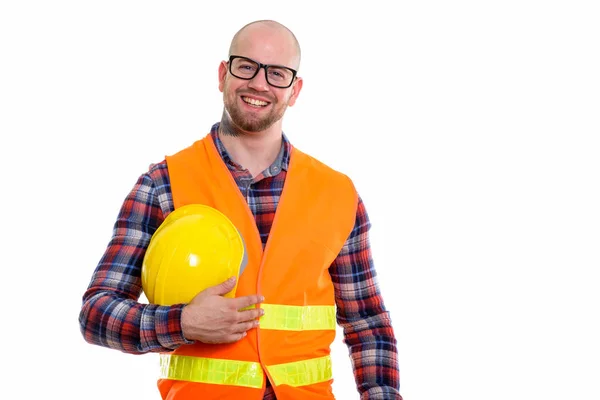 Glad Skallig Muskulös Man Byggarbetare Ler Medan Håller Skyddshjälm — Stockfoto