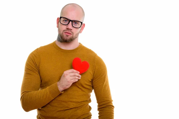 Studioaufnahme Eines Jungen Glatzköpfigen Muskulösen Mannes Der Ein Rotes Herz — Stockfoto