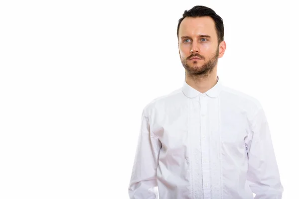 stock image Studio shot of young man thinking while looking at distance