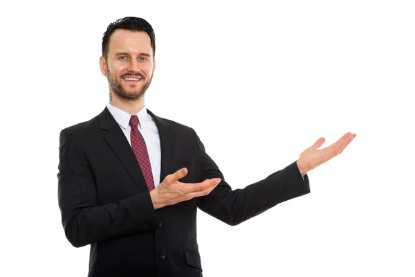 Studio Shot Young Happy Businessman Smiling While Showing Something — Stock Photo, Image