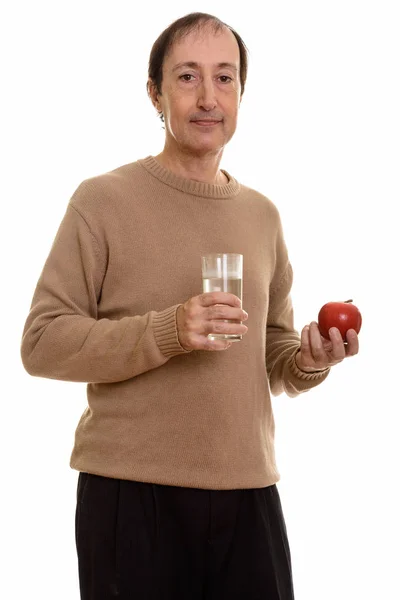 Studio Colpo Uomo Maturo Possesso Bicchiere Acqua Mela Rossa — Foto Stock