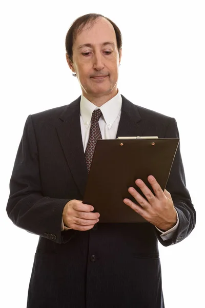 Studio Shot Mature Businessman Reading Clipboard — Stock Photo, Image