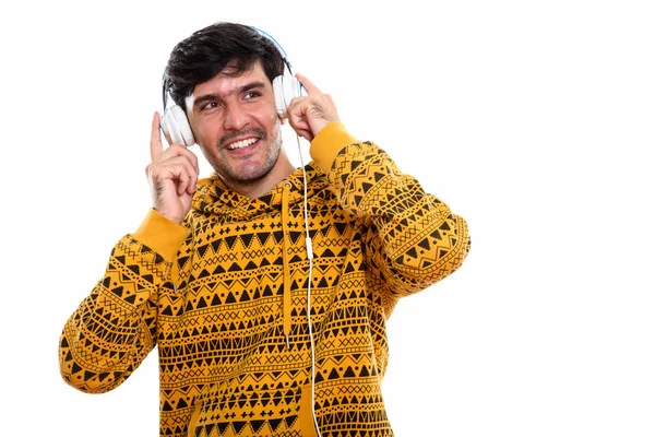 Düşünceli Genç Mutlu Ranlı Bir Adam Elinde Kulaklık Tutarak Müzik — Stok fotoğraf